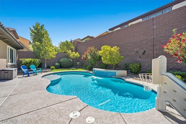 view of swimming pool with a patio area