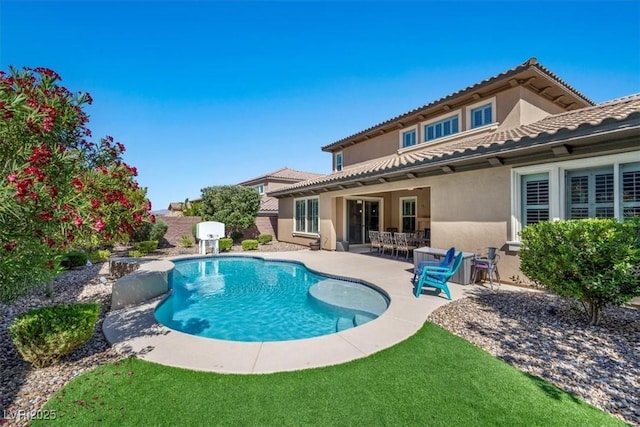 view of swimming pool with a patio area