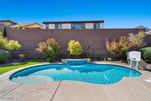 view of pool with a patio and pool water feature