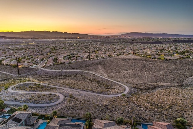 aerial view at dusk with a mountain view