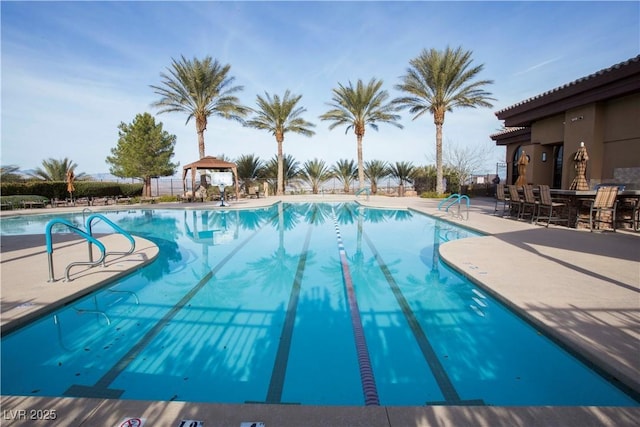 view of swimming pool featuring a patio