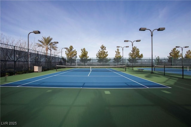 view of sport court featuring basketball hoop