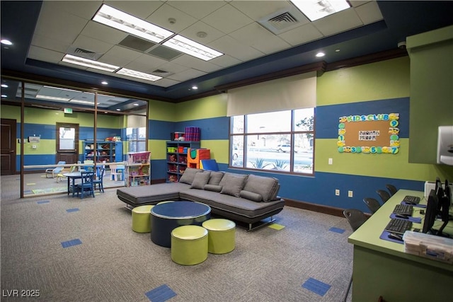 rec room featuring a paneled ceiling, a raised ceiling, and carpet floors