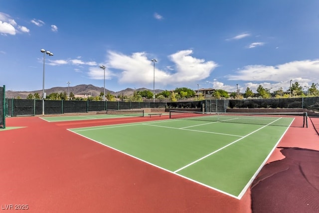 view of tennis court with a mountain view and basketball court