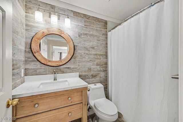 bathroom featuring walk in shower, vanity, and toilet