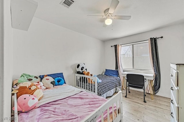 bedroom with ceiling fan and light hardwood / wood-style flooring