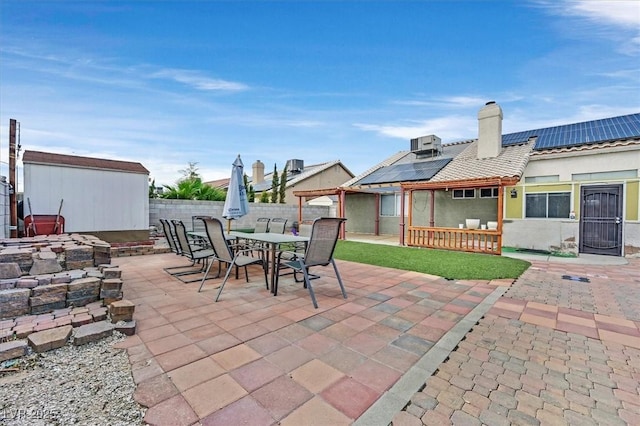 view of patio / terrace with a shed and cooling unit