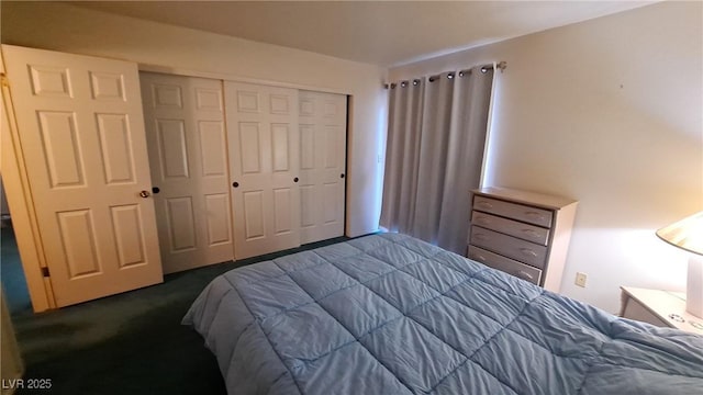 bedroom with dark carpet and a closet