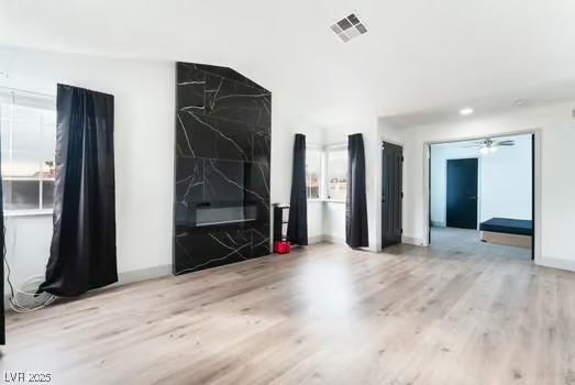 unfurnished room with light hardwood / wood-style flooring