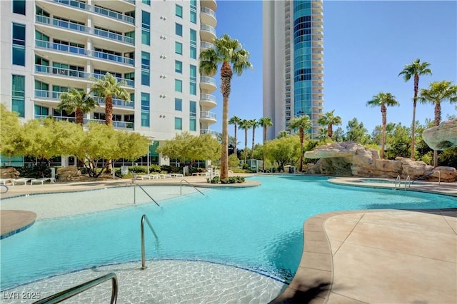 view of pool featuring a hot tub