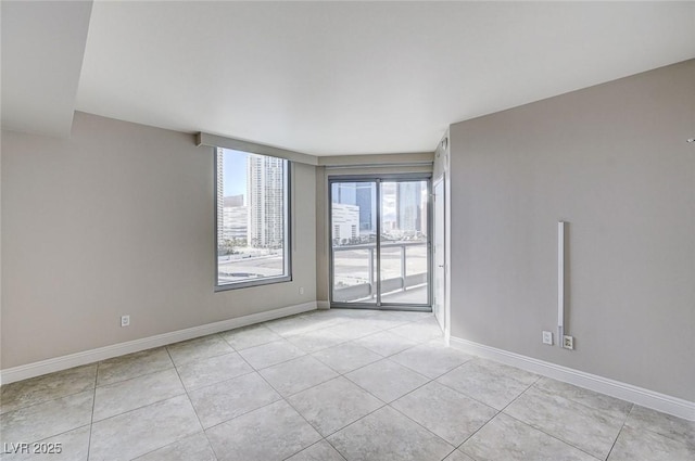 empty room with light tile patterned flooring