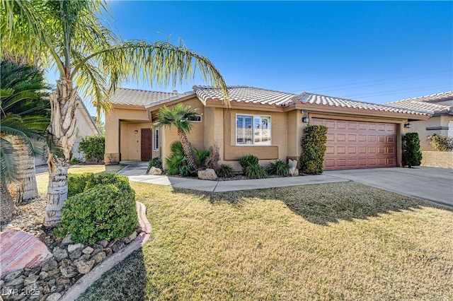 view of front of property featuring a garage and a front yard