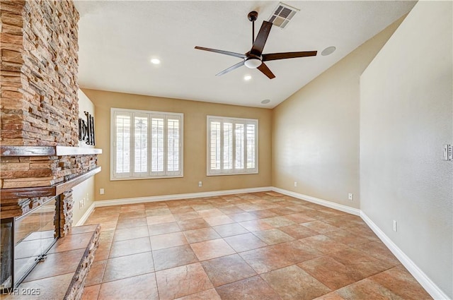 unfurnished living room featuring vaulted ceiling, light tile patterned floors, and ceiling fan