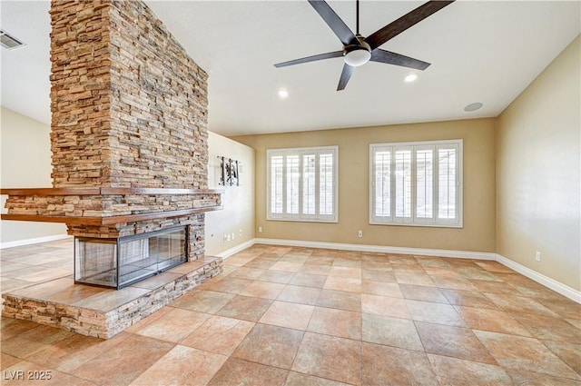 unfurnished living room with ceiling fan, a fireplace, and light tile patterned floors