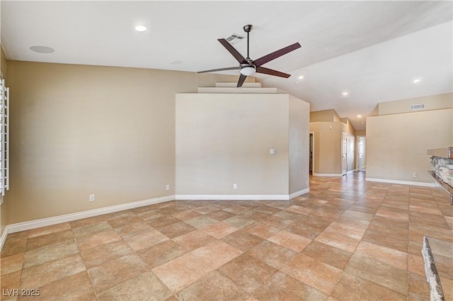 empty room with lofted ceiling and ceiling fan