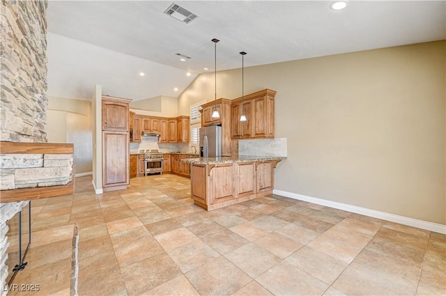 kitchen featuring appliances with stainless steel finishes, sink, hanging light fixtures, light stone counters, and kitchen peninsula