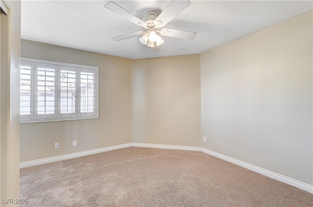 empty room with ceiling fan and light colored carpet