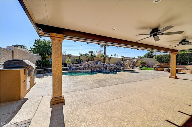 view of patio featuring a fenced in pool, pool water feature, and ceiling fan