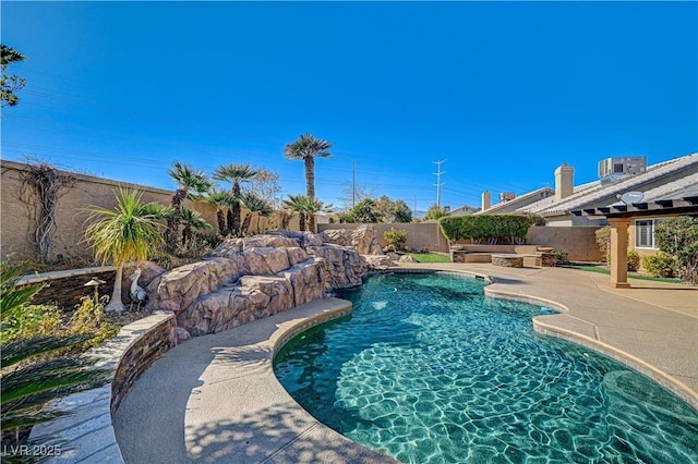 view of pool with a patio, pool water feature, and central AC unit