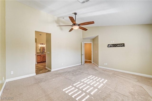 unfurnished room featuring ceiling fan, light colored carpet, and high vaulted ceiling