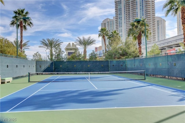 view of sport court featuring basketball hoop