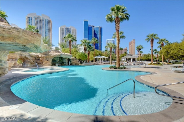 view of swimming pool featuring a gazebo, a community hot tub, and a patio area