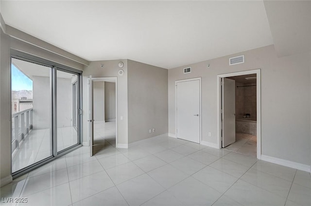 unfurnished bedroom featuring light tile patterned floors