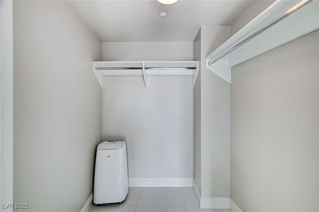 walk in closet featuring light tile patterned floors