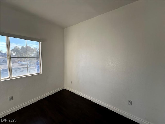 unfurnished room featuring hardwood / wood-style flooring