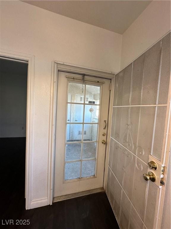 doorway to outside with dark hardwood / wood-style flooring