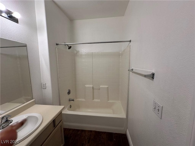 bathroom featuring shower / bathing tub combination, vanity, and hardwood / wood-style flooring