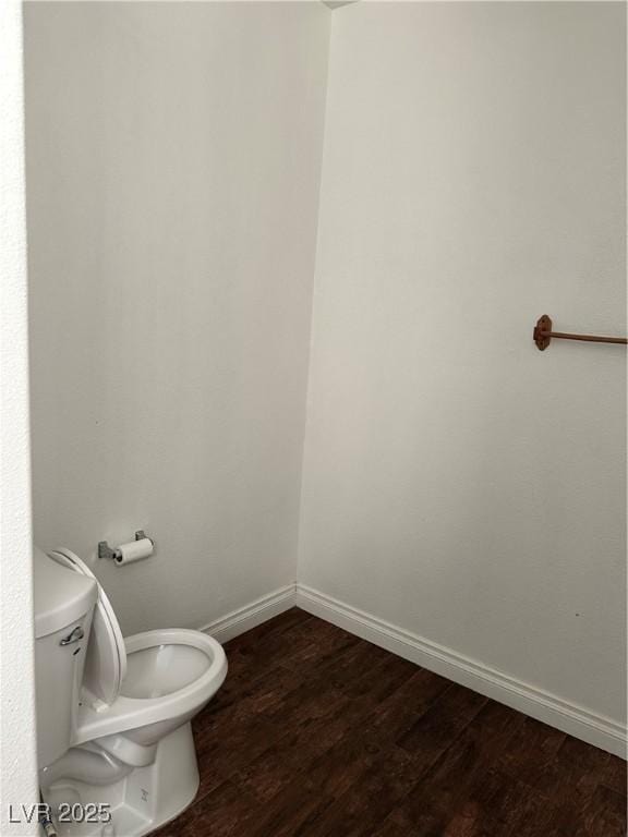 bathroom featuring toilet and hardwood / wood-style floors