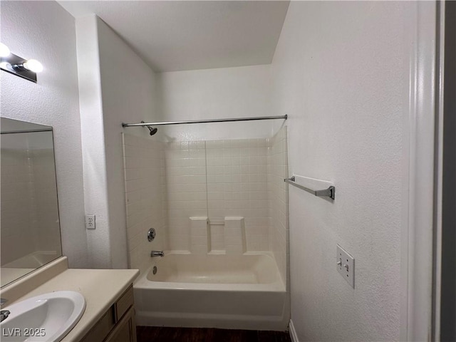 bathroom featuring shower / bathing tub combination and vanity