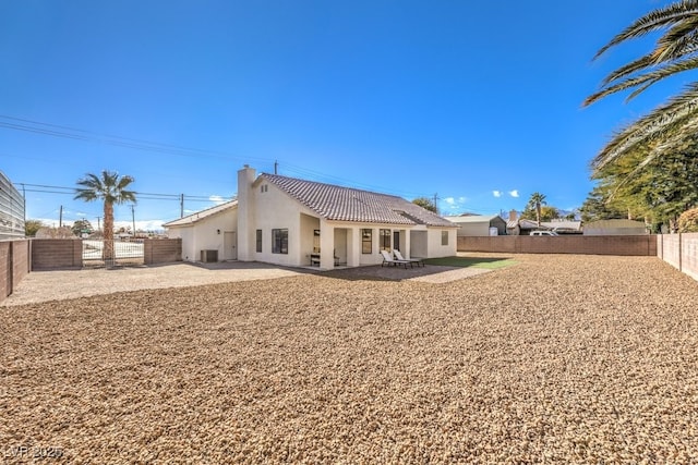 rear view of property with a patio and central air condition unit