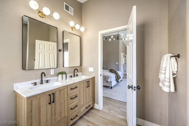 bathroom with hardwood / wood-style flooring and vanity