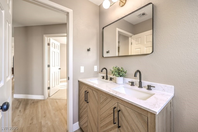 bathroom featuring wood-type flooring and vanity