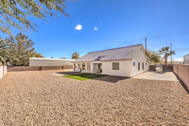 rear view of property with a patio area