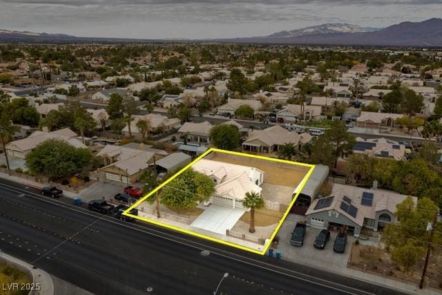 birds eye view of property with a mountain view