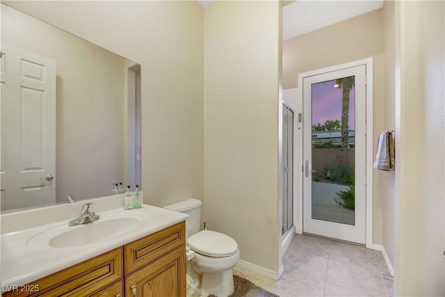 bathroom with vanity, toilet, an enclosed shower, and tile patterned flooring