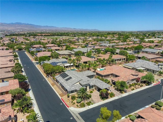 birds eye view of property with a mountain view