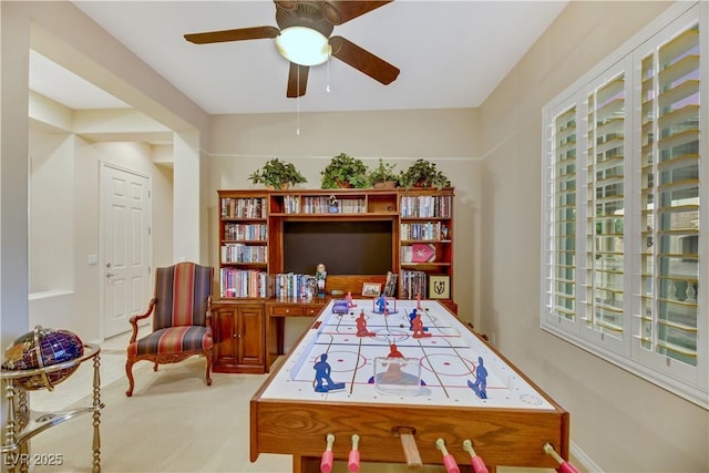 game room featuring ceiling fan and carpet