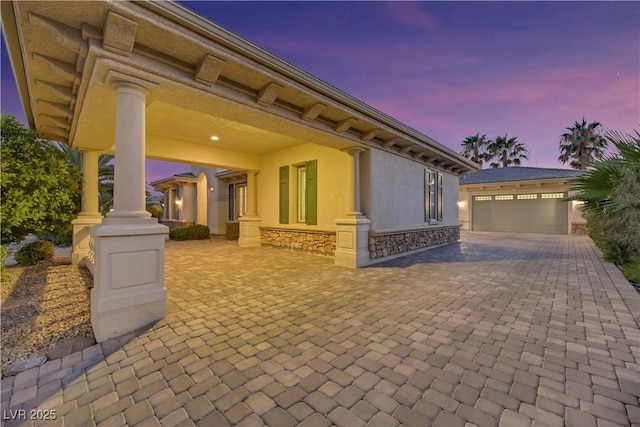 patio terrace at dusk with a garage