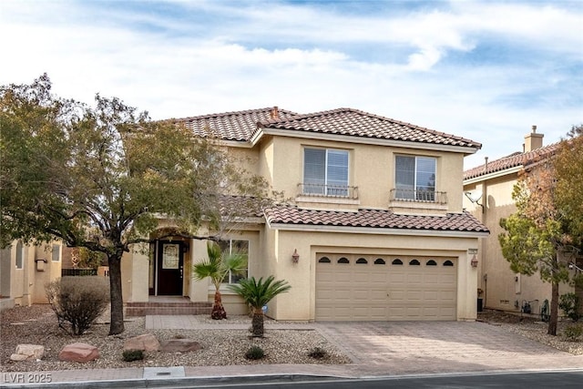 mediterranean / spanish-style home with a garage