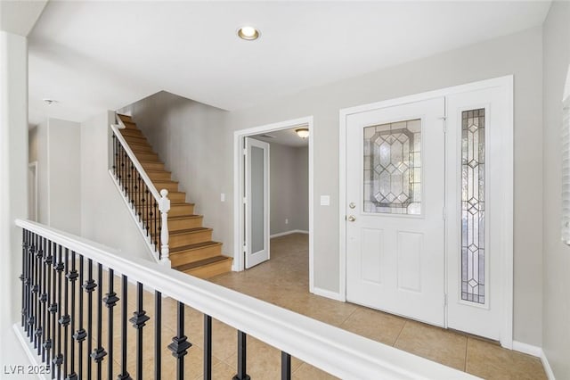 foyer entrance with tile patterned flooring