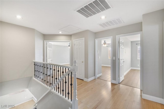 corridor featuring light hardwood / wood-style floors