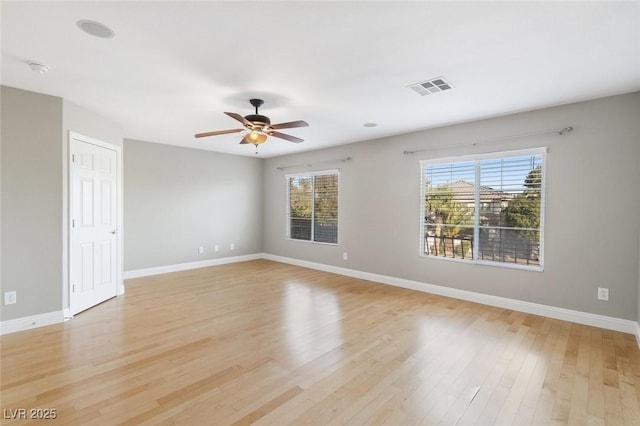 spare room featuring ceiling fan and light hardwood / wood-style flooring