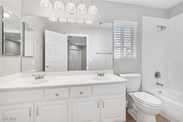 full bathroom featuring toilet, vanity, and shower / bathing tub combination