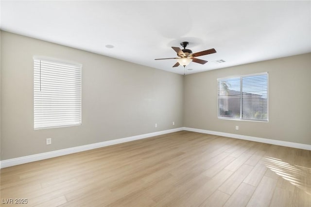 empty room featuring light hardwood / wood-style floors and ceiling fan