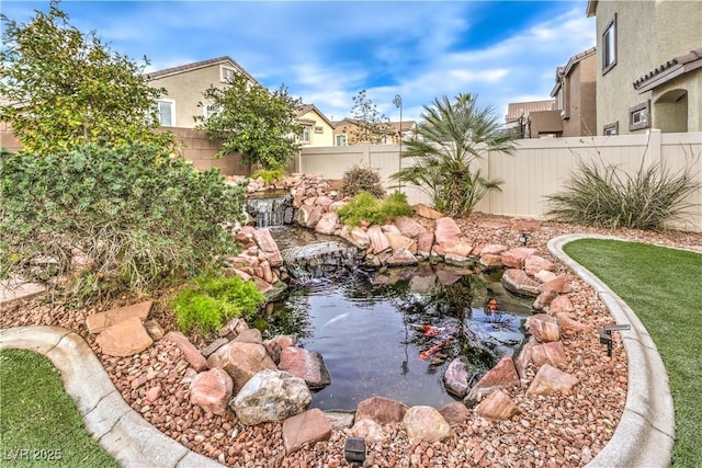 view of yard with a garden pond