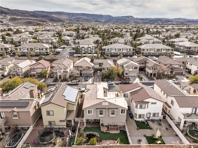 birds eye view of property with a mountain view